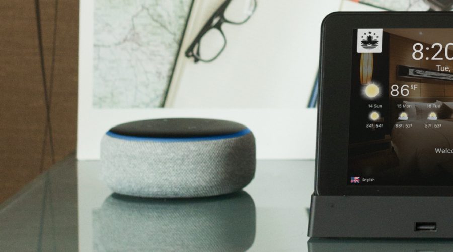 Voice - An Echo Dot sitting on a table, next to an Android tablet